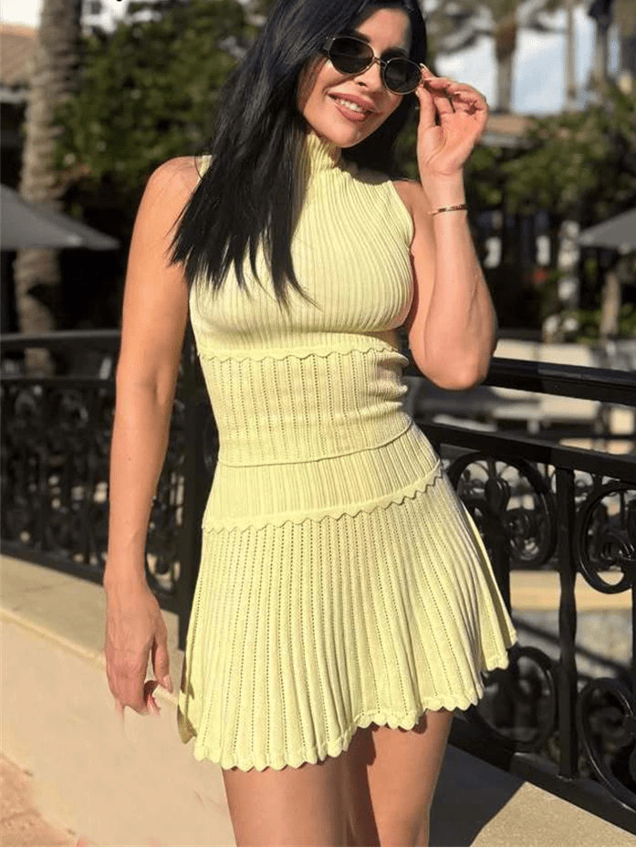 Kelly tweedelige gebreide set met cropped top en geplooide minirok
