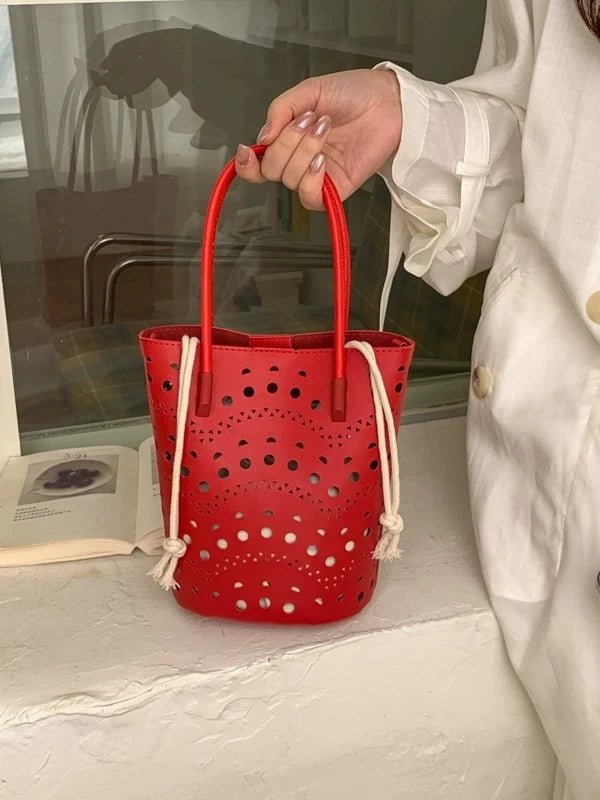 Lara bucketbag met uitsparingen