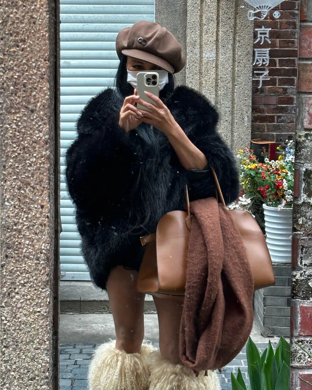 Nicki jas van imitatiebont met capuchon