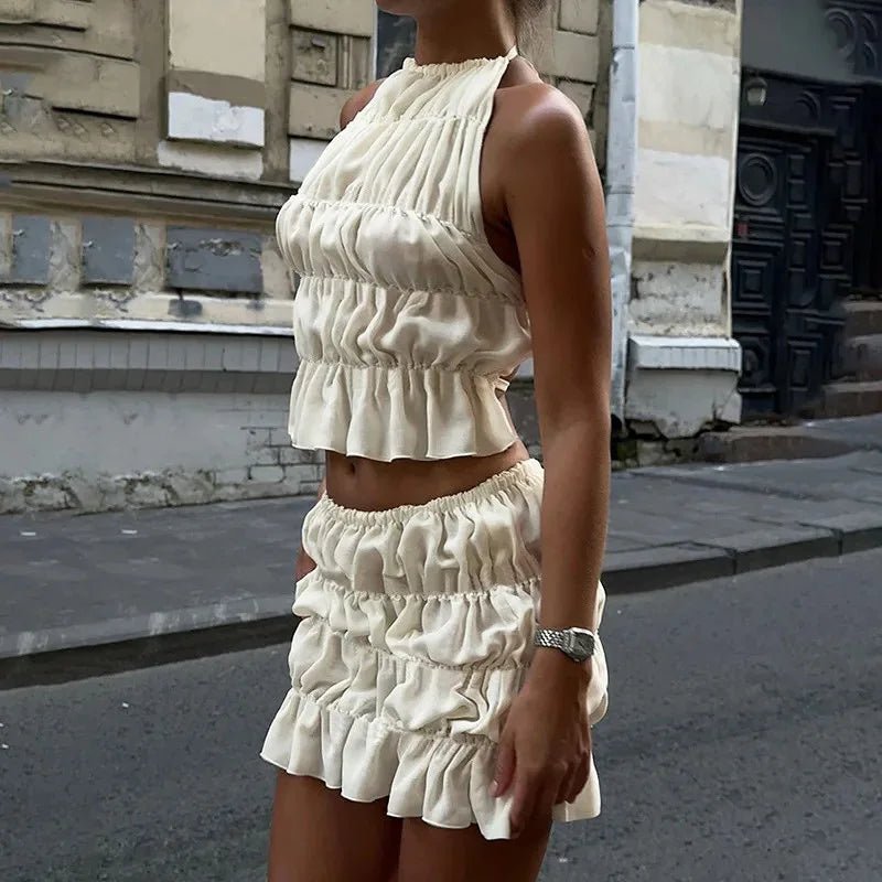 Priya-set met top met striksluiting en geplooide rok