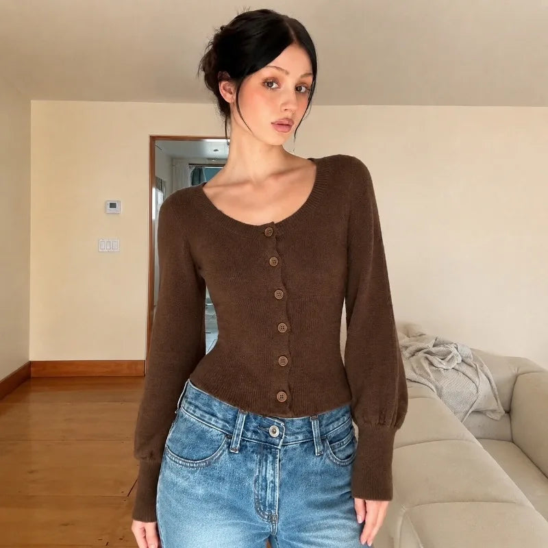 Mae gebreid vest met pofmouwen