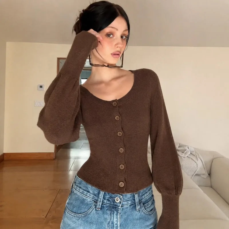 Mae gebreid vest met pofmouwen