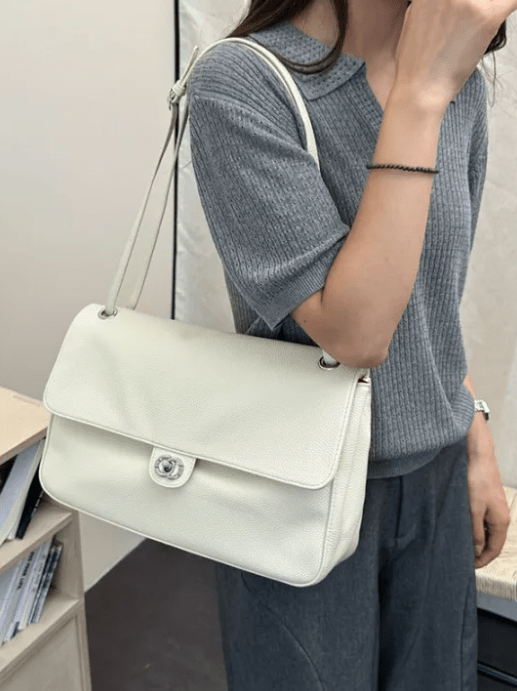 Solveig Buckle Flap Shoulder Bag in white – styled look